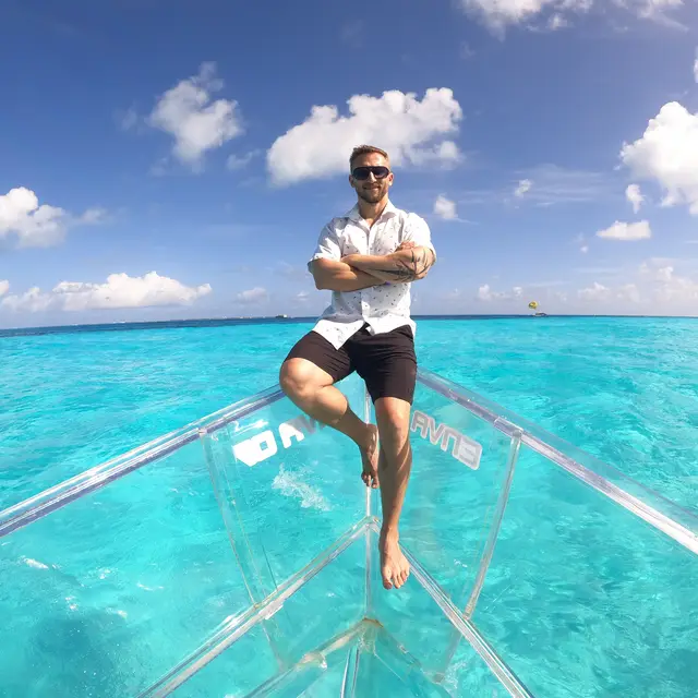 Kay Honig on a glass-bottom boat over turquoise Caribbean waters